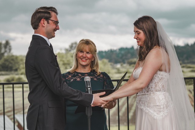 Rhonda leading a couple through their vows